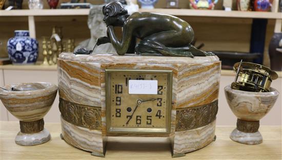 An Art Deco bronze and marble figural clock garniture, with battery and clockwork movements